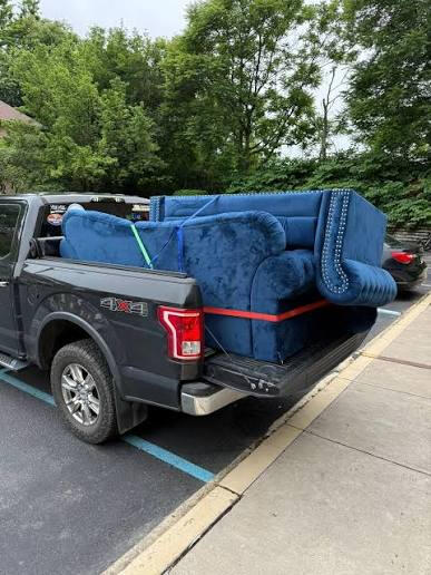 Couch loaded for haul-away Couch loaded for haul-away